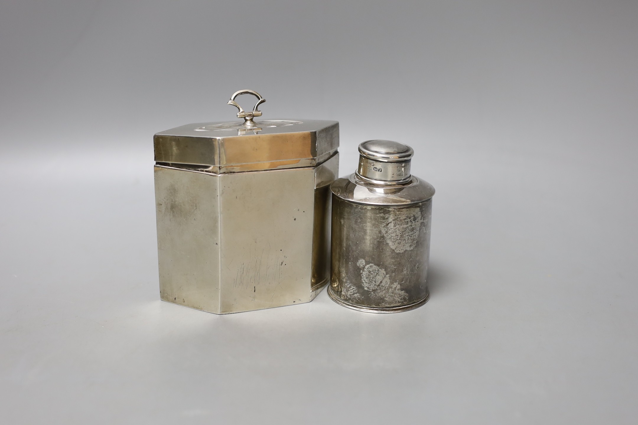 A George V silver hexagonal tea caddy, with bat's wing motif, Thomas Bradbury & Sons, London, 191, width 11.1cm and a smaller silver tea caddy